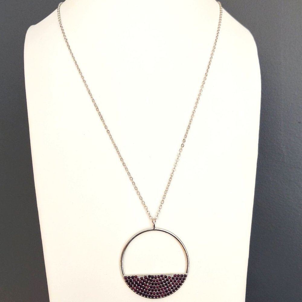 Long silver pendant necklace with purple inlaid crystals